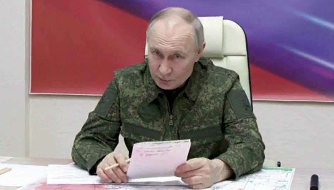 Speaking while dressed in fatigues, President Vladimir Putin says his