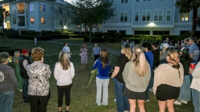 Several dozen people gathered Saturday at an apartment complex along