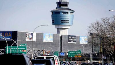 The wing of a passenger plane landing at LaGuardia International