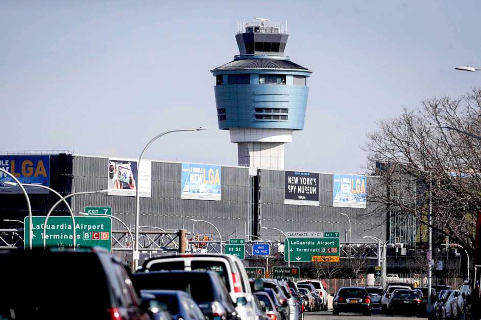 The wing of a passenger plane landing at LaGuardia International