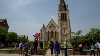 People taking a quiet stroll through the mock Tudor streets